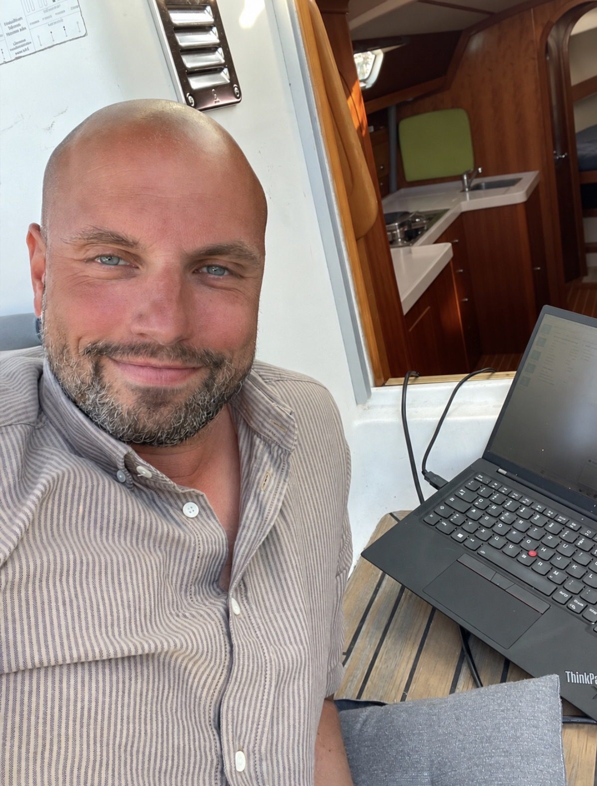Anders with his ThinkPad, working below deck on his sailboat